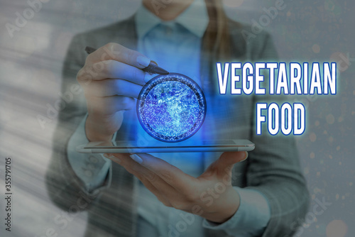 Writing note showing Vegetarian Food. Business concept for refers to the cuisine that fulfills a vegan s is conditions Elements of this image furnished by NASA photo