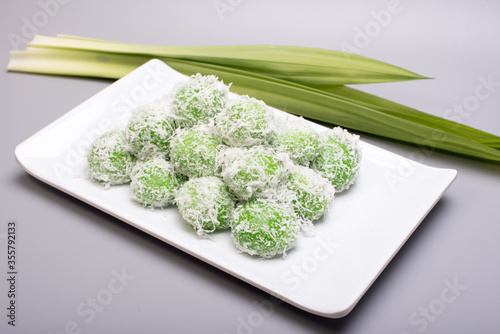 A set of traditional confectionery famous in Malaysia,Indonesia and Singapore,know as Buah Melaka or ondeh-ondeh ,isolated over grey,food photography concept 