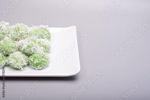 A set of traditional confectionery famous in Malaysia,Indonesia and Singapore,know as Buah Melaka or ondeh-ondeh ,isolated over grey,food photography concept 
