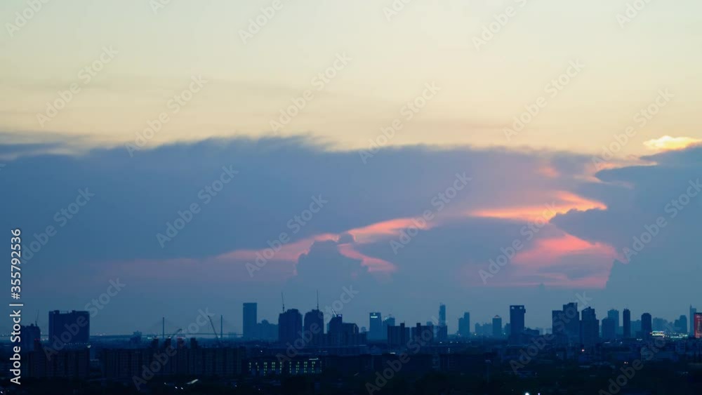 4K Time lapse sunset sunrise and beautiful twilight fluffy storm cloudy blue and yellow sky smoothly flowing to fantastic mind. Rainy good evening and have a nice day concept. 4K Time lapse sunset sunrise and beautiful twilight fluffy storm cloudy blue and yellow sky smoothly flowing to fantastic mind. Rainy good evening and have a nice day concept.