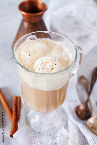 coffee with ice cream in a glass on a table, selective focus