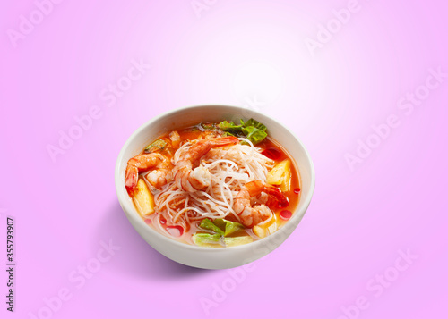 Tom Yam Shrimp soup with Thai spices, spicy gravy topped with celery, vermicelli and mushrooms