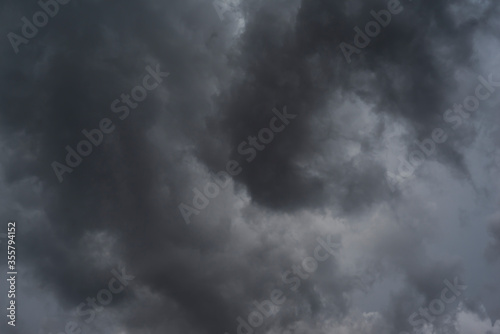 Dark clouds background. The sky is covered all over by clouds before rainfall.