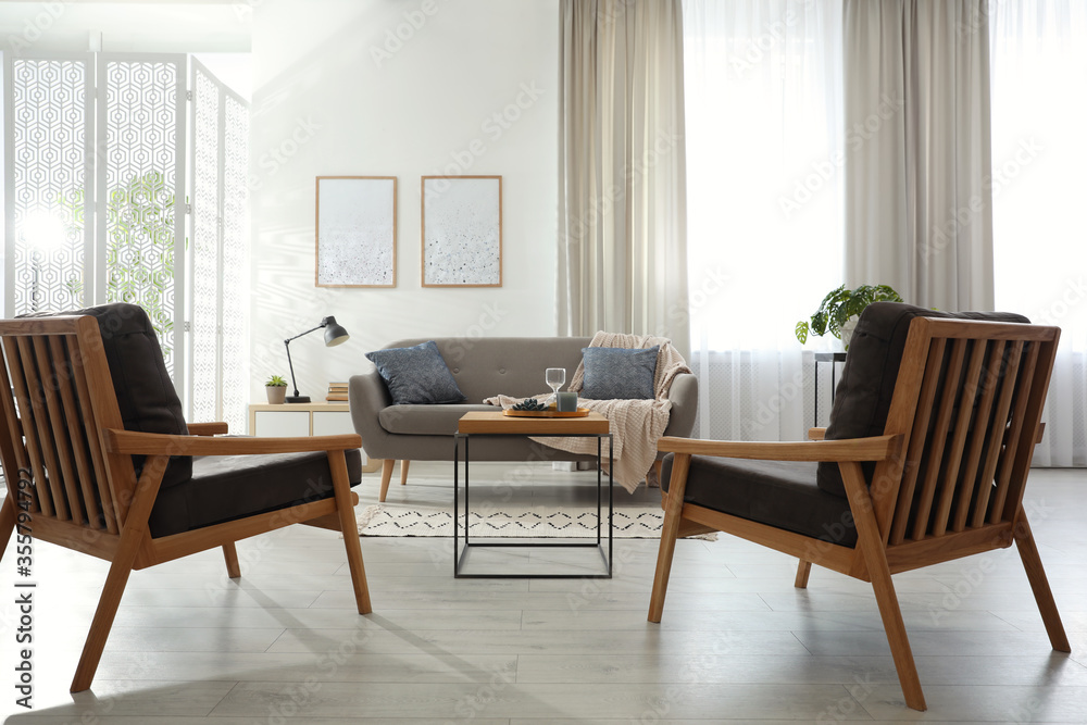 Modern living room interior with comfortable sofa and armchairs Modern living room interior with comfortable sofa and armchairs