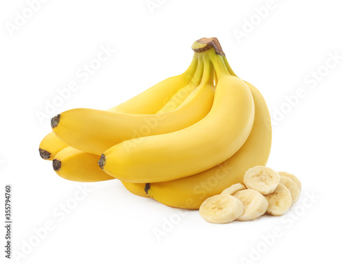Delicious ripe bananas and pieces isolated on white