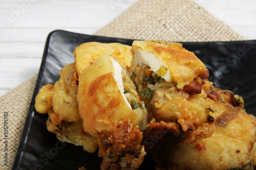 Tahu susur, a kind of Indonesian food that made from fried tofu that filled with vegetables photo