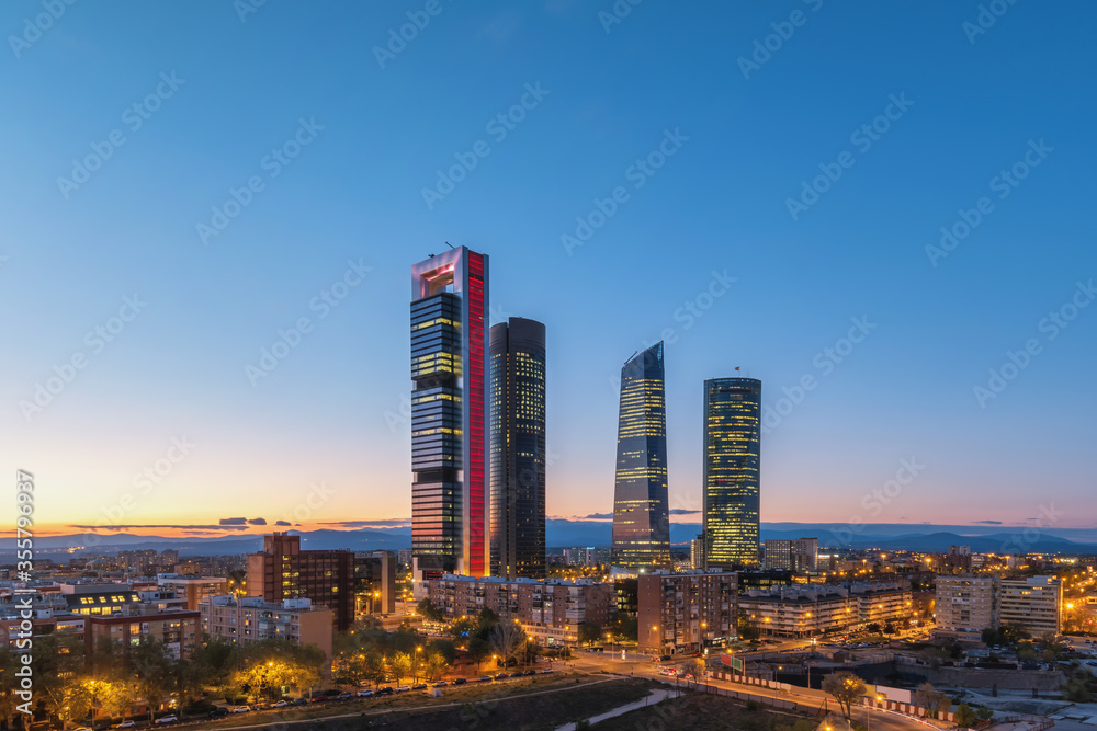 Madrid Spain, night city skyline at financial district center with four towers - obrazy, fototapety, plakaty 