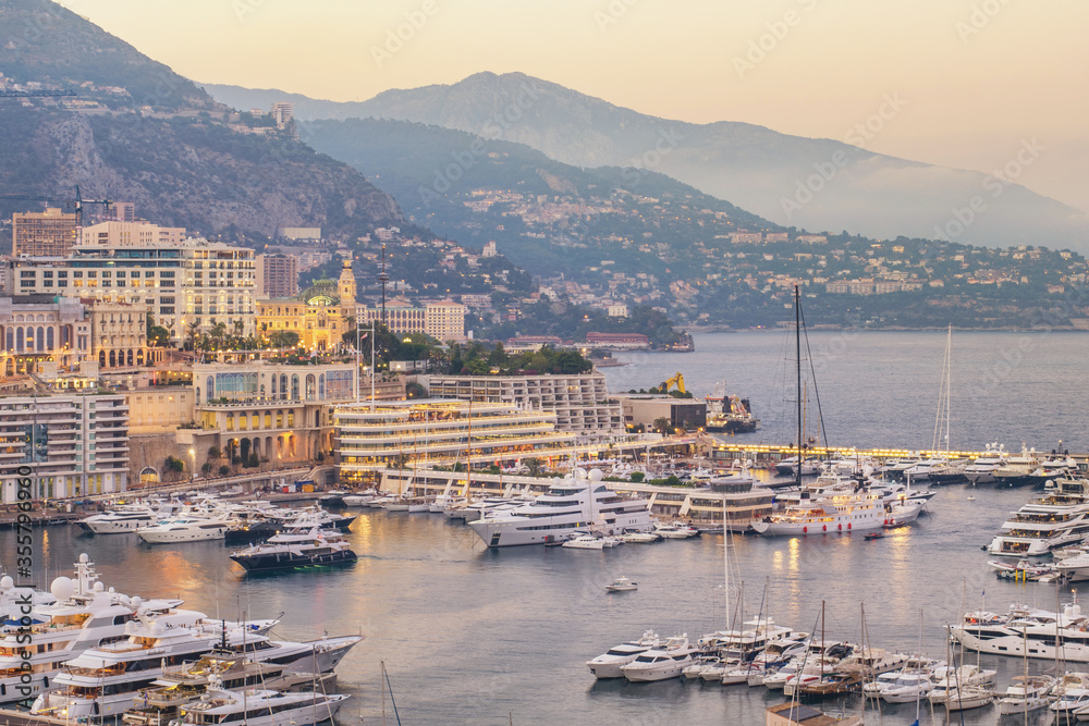 Monte Carlo Monaco, city skyline sunset at Ville port