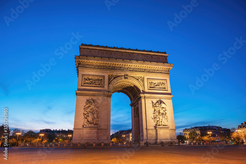 Paris France night city skyline at Arc de Triomphe and Champs Elysees © Noppasinw