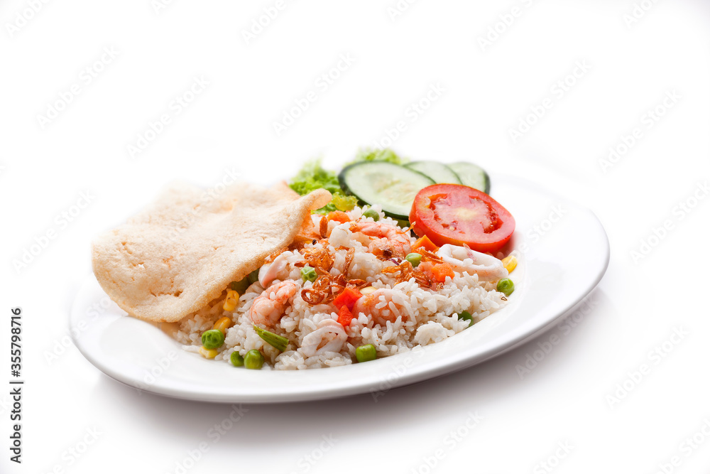Seafood fried rice. Cooked white rice seasoning, shrimp, sliced squid, peas, corn kernels. Sliced with cucumbers, tomatoes, lettuce and crackers. Seafood fried rice. Cooked white rice seasoning, shrimp, sliced squid, peas, corn kernels. Sliced with cucumbers, tomatoes, lettuce and crackers.