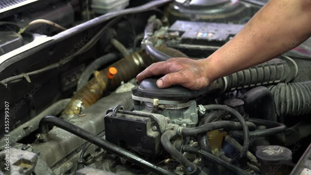 Auto mechanic working on car engine Auto mechanic working on car engine