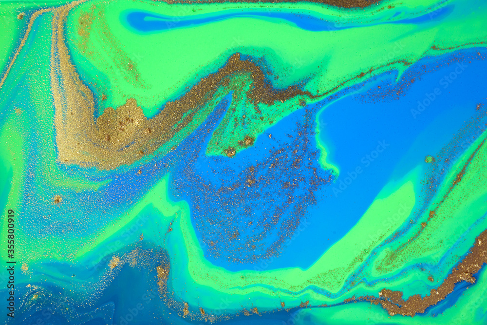 Green and blue mixed inks. Artwork paint stains with gold powder scattering. Green and blue mixed inks. Artwork paint stains with gold powder scattering.
