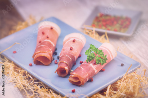 Italian ham on wooden background