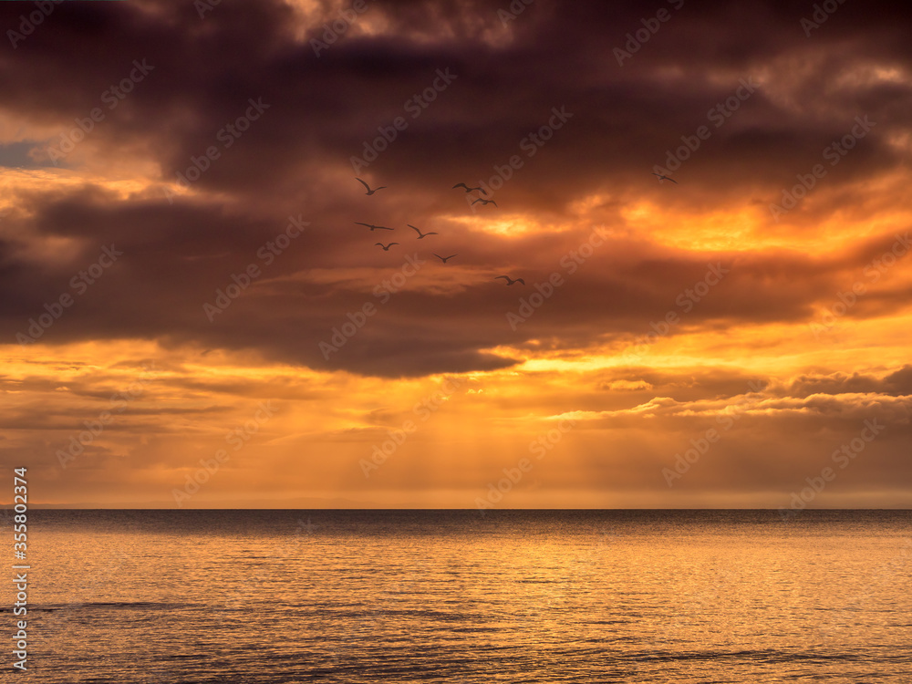 Ocean Sunrise with Golden Light and Sunbeams