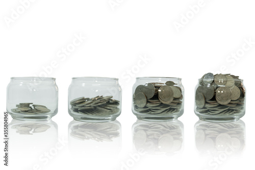 Money growing step with deposit coin, Saving money in jar, Money isolated on white background, Clipping path
