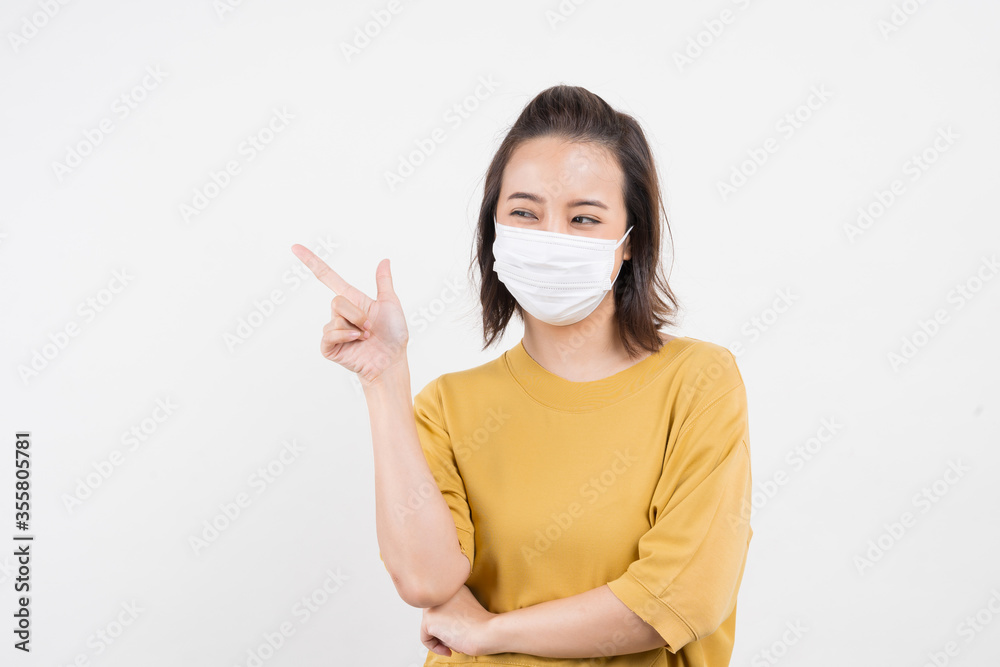 Young Asian woman wearing hygienic mask to prevent infection corona virus Air pollution pm2.5 she wearing a yellow T-shirt shoot in shot isolated on white background Young Asian woman wearing hygienic mask to prevent infection corona virus Air pollution pm2.5 she wearing a yellow T-shirt shoot in shot isolated on white background
