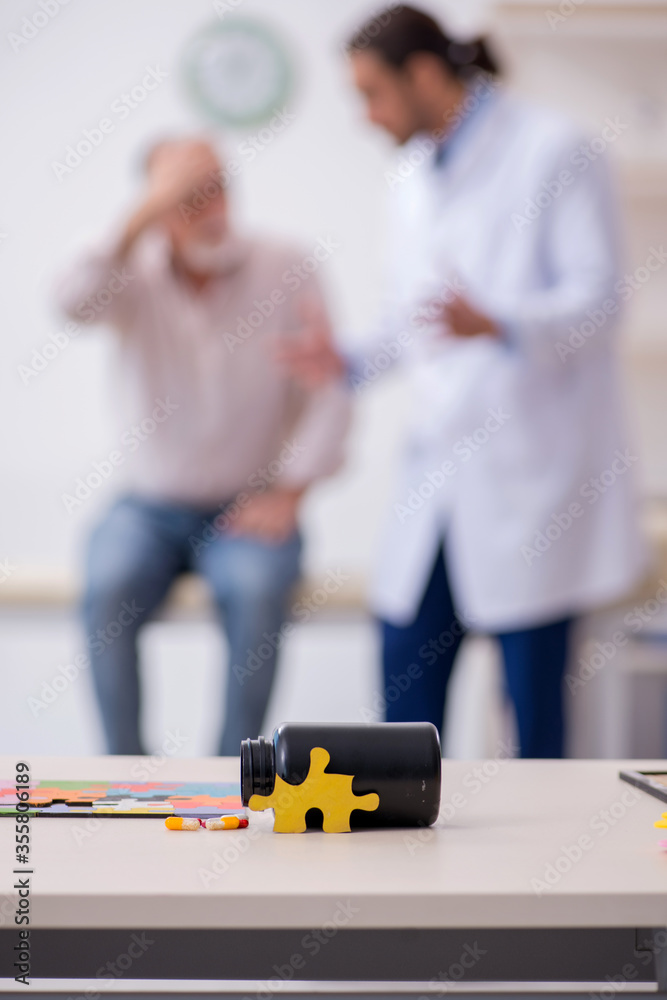 Doctor and patient suffering from Alzheimer disease Doctor and patient suffering from Alzheimer disease