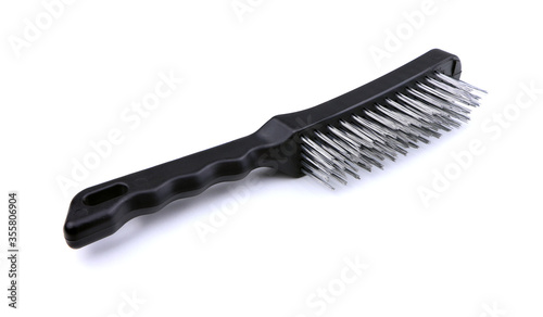 A metal wire brush for cleaning isolated on a white background. Tools fof welding. Weld gear. Wire brush for cleaning
