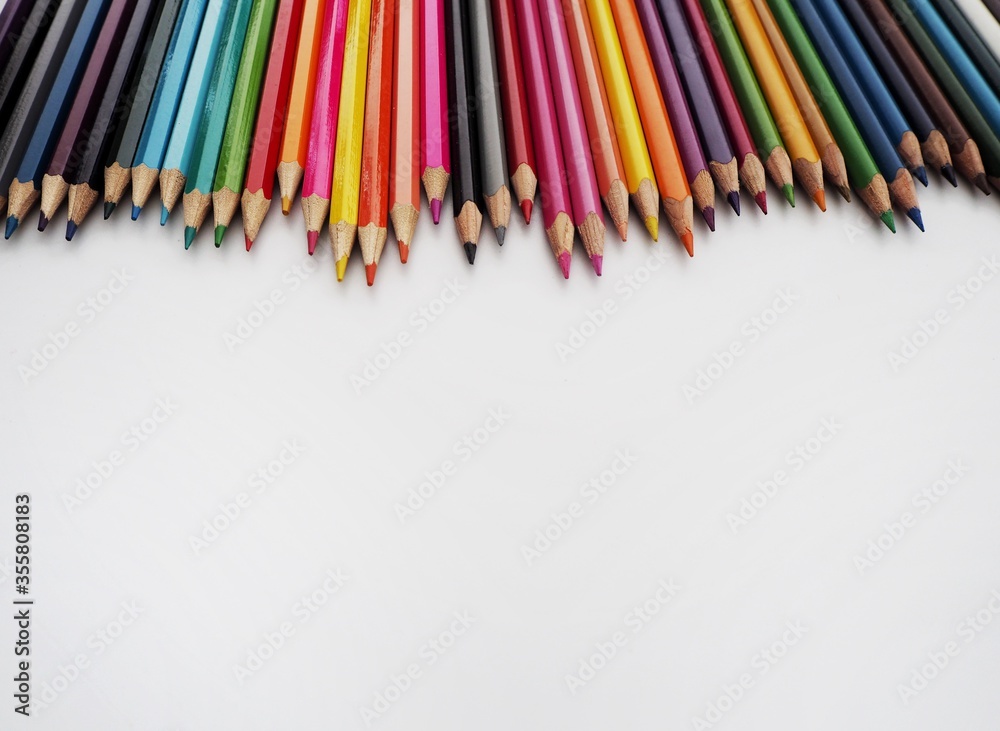 The education concept, Color pencils with copy space on isolated white background. The education concept, Color pencils with copy space on isolated white background.