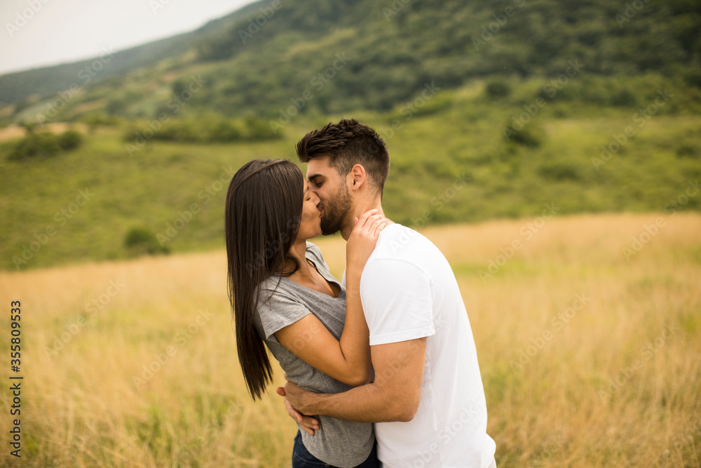 Pretty young couple in love outside in spring nature Pretty young couple in love outside in spring nature