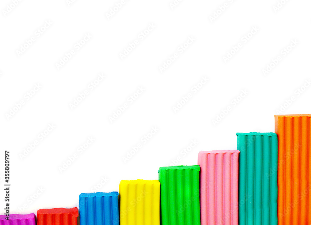 Colorful modeling clay, plasticine as a frame over white a white background. Frame with place for text. Percentage growth graph concept. Finance, business, interest. Bank, payments, credit. Colorful modeling clay, plasticine as a frame over white a white background. Frame with place for text. Percentage growth graph concept. Finance, business, interest. Bank, payments, credit.