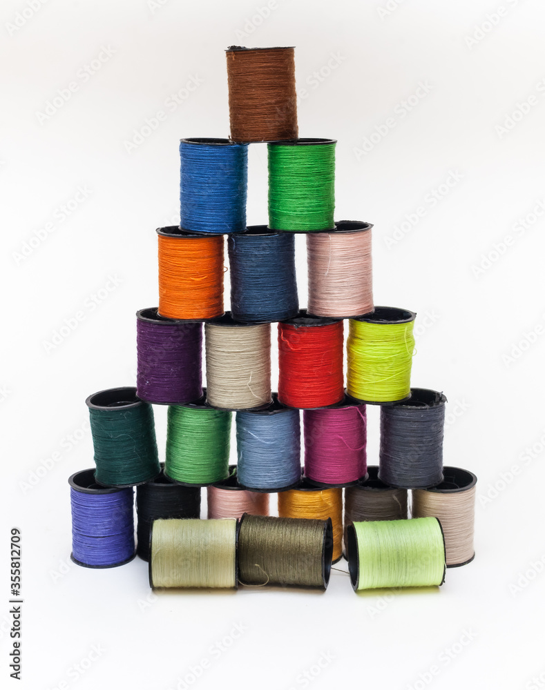 Coil set with colored thread on a white background Coil set with colored thread on a white background