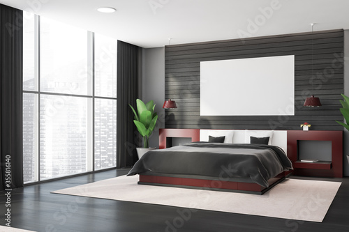 Grey and wooden master bedroom corner with poster