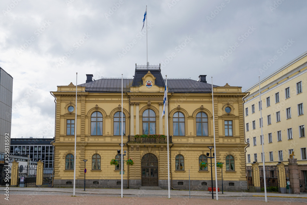 Fototapeta premium The old town hall building on a cloudy June morning, Hameenlinna. Finland