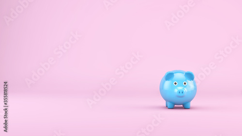 Blue piggy bank on pink background