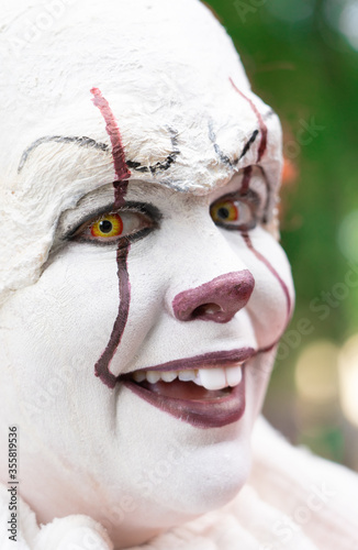 Fototapeta Naklejka Na Ścianę i Meble -  White make-up face of a laughing clown