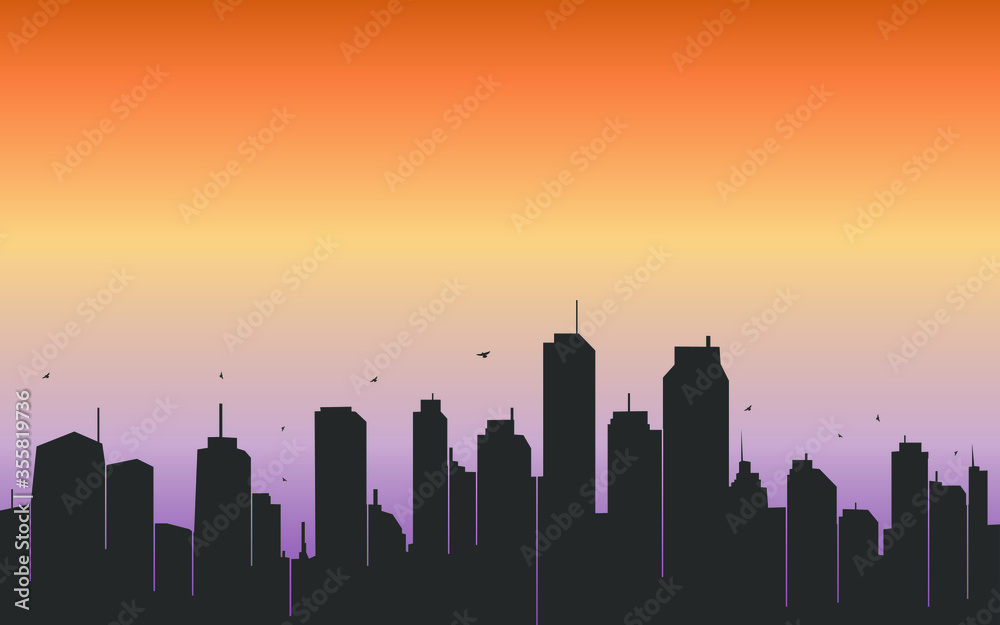 silhouette of modern growing city and sunrise in the background  