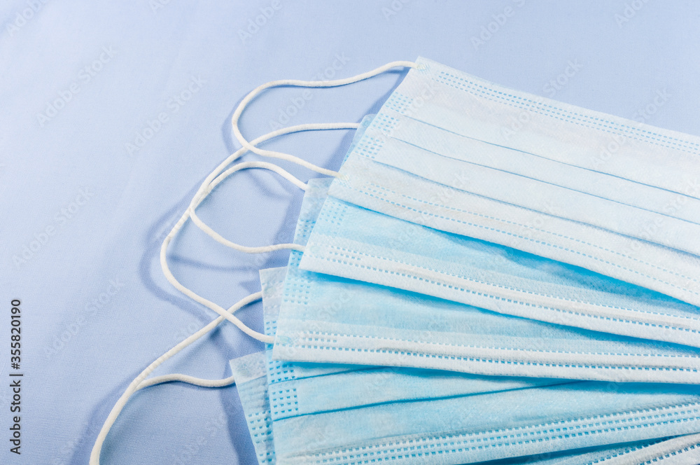 Background concept for news about the novel coronavirus COVID-19 pandemic, antiviral medical mask for protection against coronavirus. Surgical protective mask. Medical respiratory bandage face Background concept for news about the novel coronavirus COVID-19 pandemic, antiviral medical mask for protection against coronavirus. Surgical protective mask. Medical respiratory bandage face