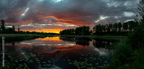 panoramic view, gorgeous and colorful sunset landscape on the lake
