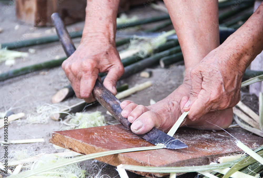 How to scrape the fiber from the bark by knife , prepared for weaving reed mat , handmade thai style How to scrape the fiber from the bark by knife , prepared for weaving reed mat , handmade thai style