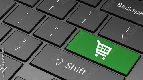 computer keyboard with special green shopping cart icon key close up