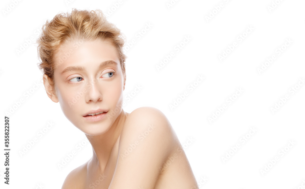 Young beautiful woman with blond hair and blue eyes, posing with naked shoulders looking away, isolated on white background. Beauty skin care cosmetic ads Young beautiful woman with blond hair and blue eyes, posing with naked shoulders looking away, isolated on white background. Beauty skin care cosmetic ads