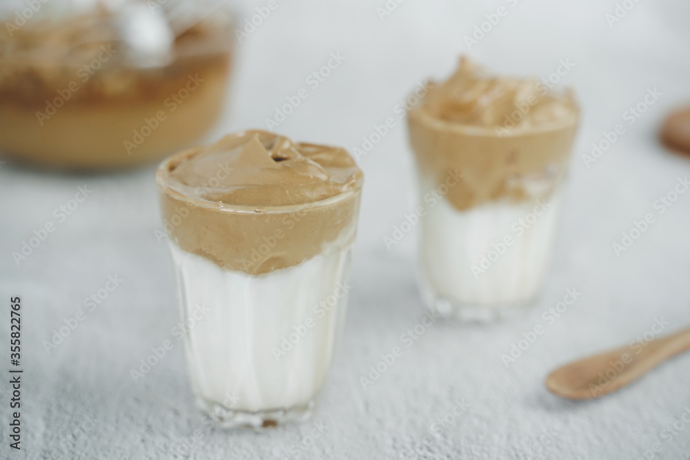 Iced Dalgona Coffee, a trendy fluffy creamy whipped coffee. Summer iced coffee.with copyspace for your text. Iced Dalgona Coffee, a trendy fluffy creamy whipped coffee. Summer iced coffee.with copyspace for your text.