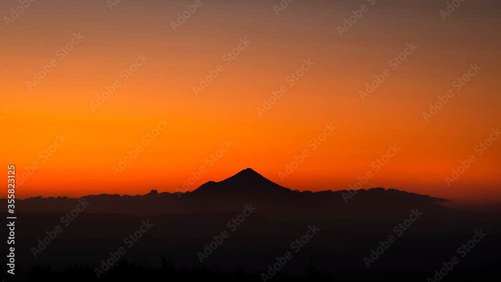 Panoramic view of silhouette Mt Taranaki at sunset. Viewed from Tongariro National park