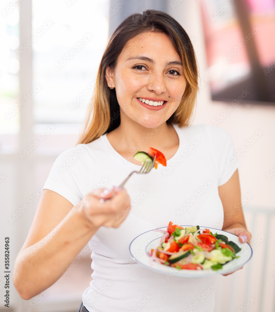 Young woman have lunch at home eating freshness salad