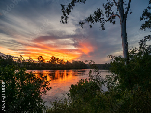 Golden River Sunset with Reflections