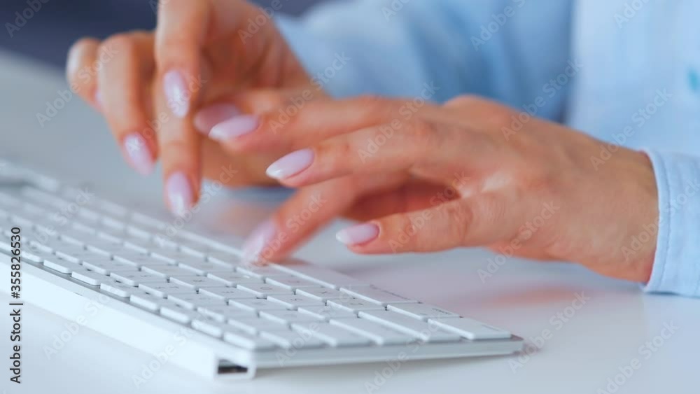 Woman typing on a computer keyboard. Concept of remote work. Woman typing on a computer keyboard. Concept of remote work.