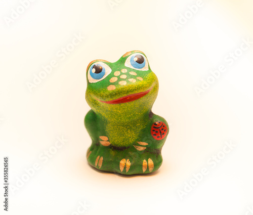 Toy "Smiling frog" ceramic on white background