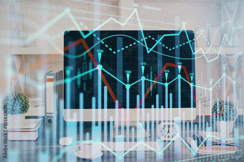 Forex graph hologram on table with computer background. Double exposure. Concept of financial markets. Forex graph hologram on table with computer background. Double exposure. Concept of financial markets.