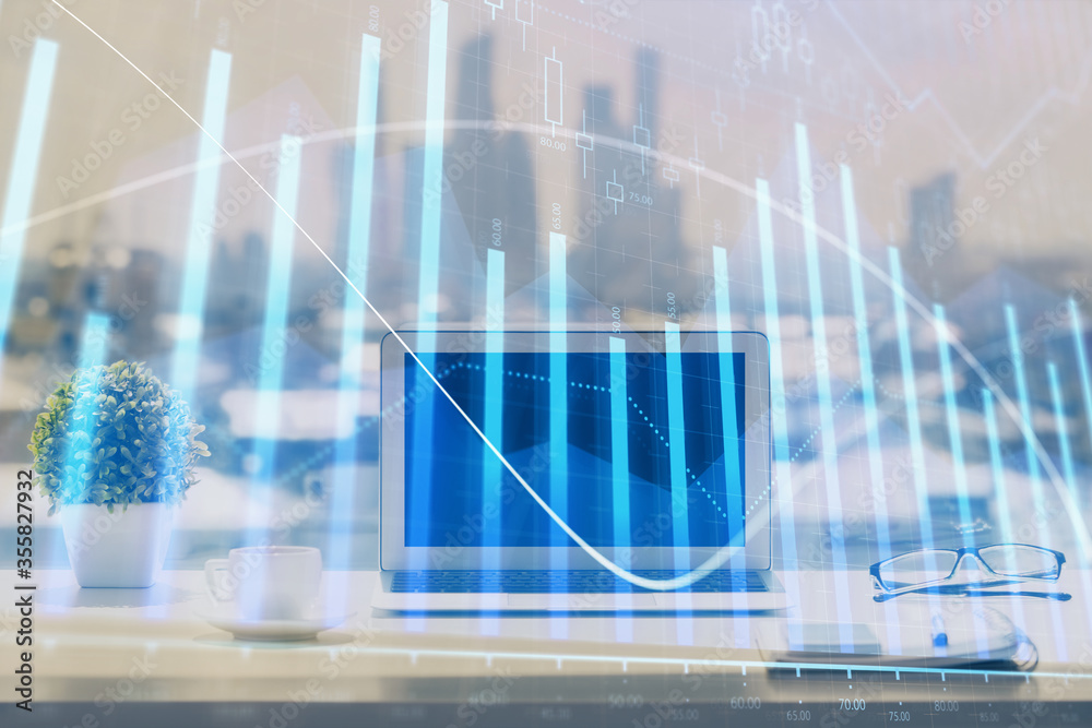 Forex graph hologram on table with computer background. Multi exposure. Concept of financial markets. Forex graph hologram on table with computer background. Multi exposure. Concept of financial markets.