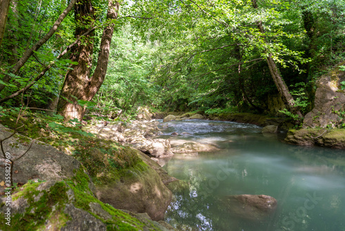 black river that comes from the marmore waterfalls