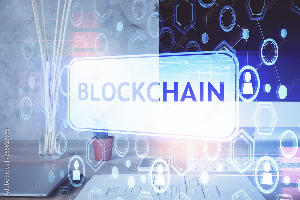 Double exposure of blockchain and crypto economy theme hologram and table with computer background. Concept of bitcoin cryptocurrency. Double exposure of blockchain and crypto economy theme hologram and table with computer background. Concept of bitcoin cryptocurrency.