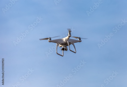 The quadcopter on the background of blue sky