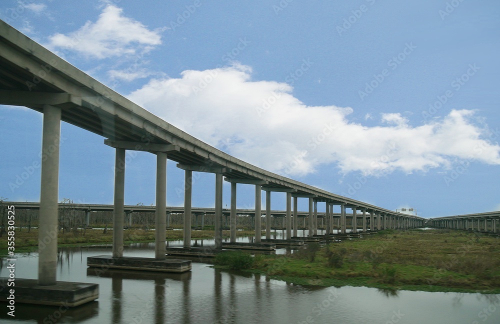 Long bridges at the Super Highway interstate over the Louisiana Bayou in New Orleans, Louisiana Long bridges at the Super Highway interstate over the Louisiana Bayou in New Orleans, Louisiana