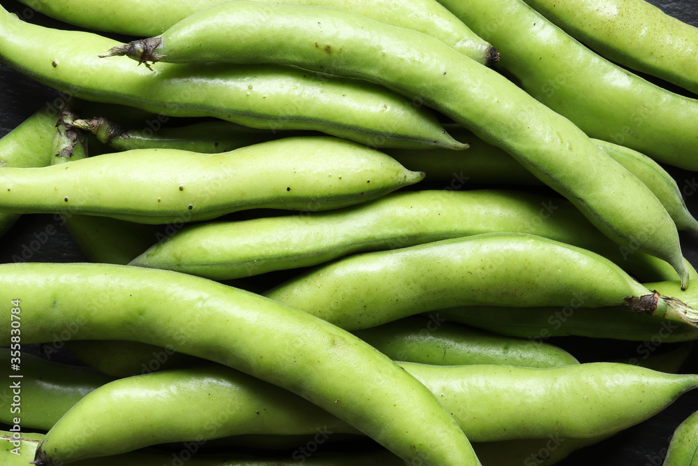 Photography of a bunch of broad beans in pods for food background