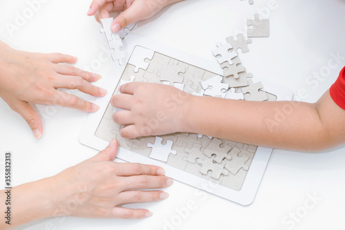 Adults and children development to jigsaw the skills, ideas, abilities